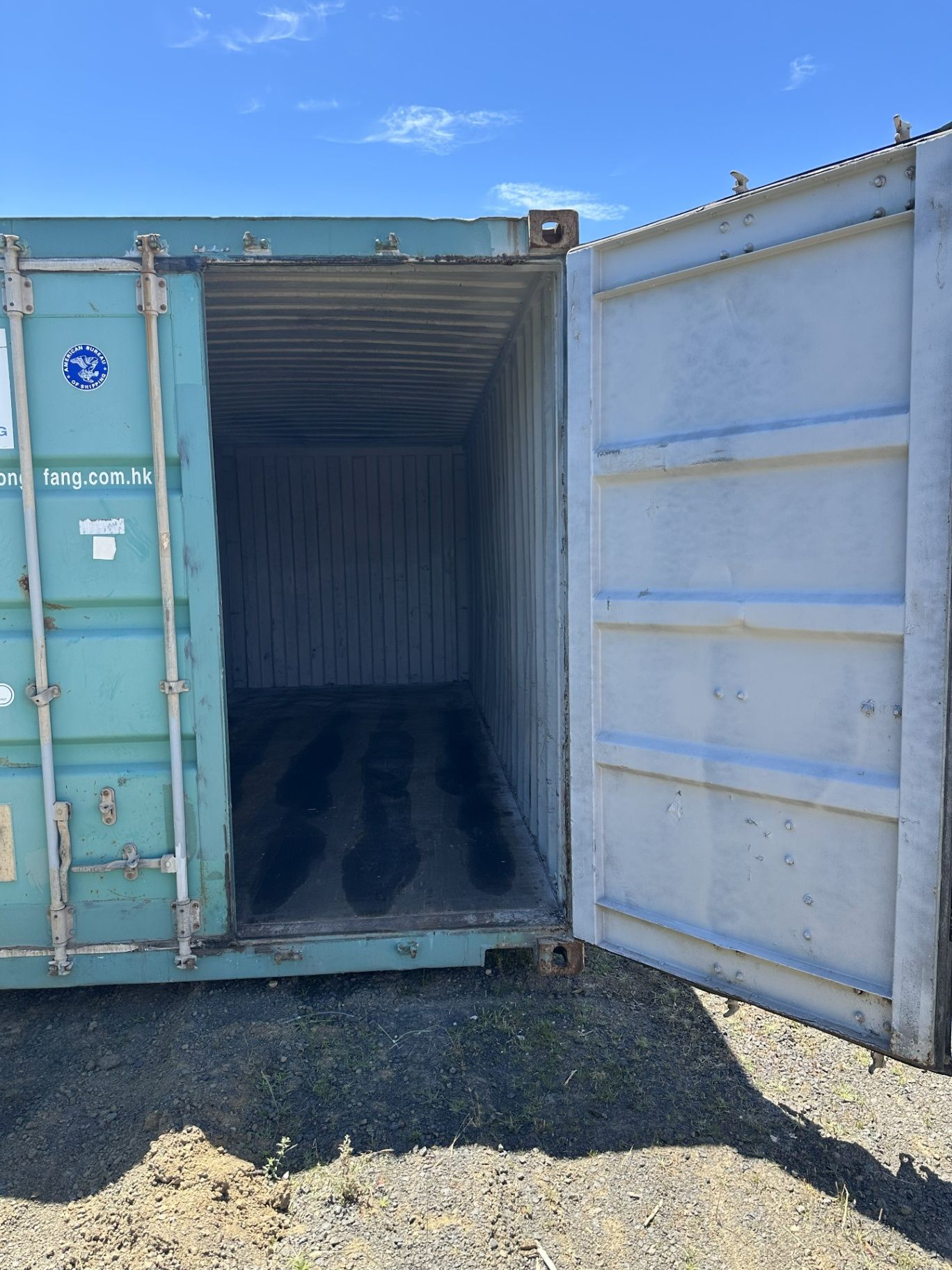 Open Shipping Container With Blue Doors in a Gravel Yard — Connect Trailers and Towing Pty Ltd In Prospect Vale, TAS