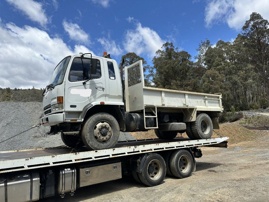 White Dump Truck on A Flatbed Trailer — Connect Trailers and Towing Pty Ltd In Prospect Vale, TAS 