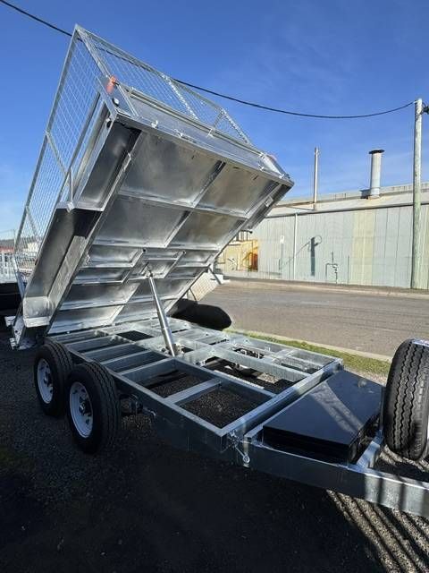 Tilted Silver Utility Trailer With Raised Dump Bed — Connect Trailers and Towing Pty Ltd In Prospect Vale, TAS