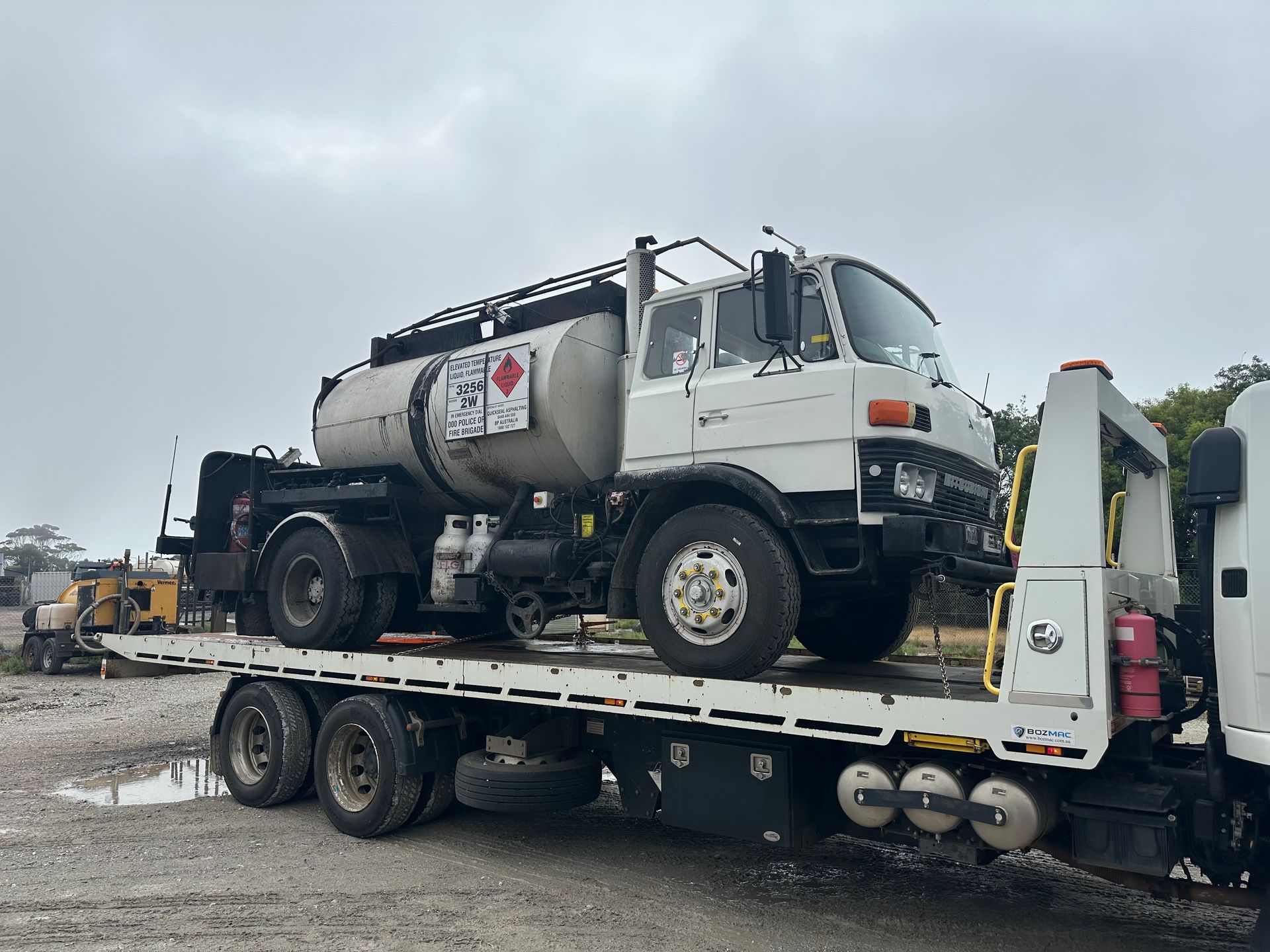 White Tanker Truck on A Flatbed Trailer — Connect Trailers and Towing Pty Ltd In Prospect Vale, TAS 