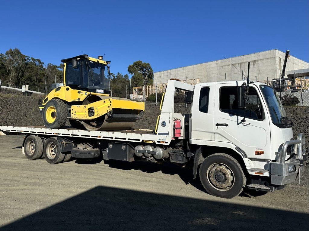 Yellow Road Roller on a Flatbed Truck — Connect Trailers and Towing Pty Ltd In Prospect Vale, TAS