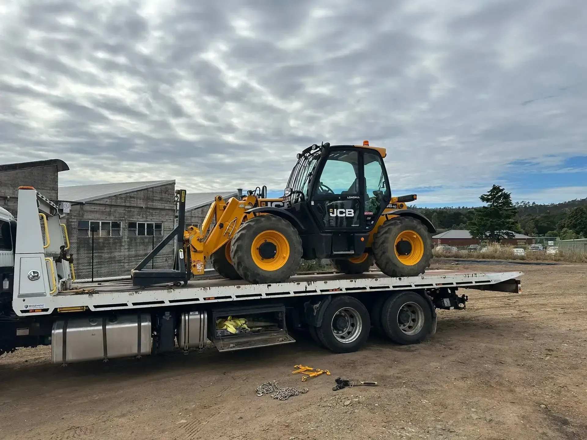 Yellow JCB Telehandler Secured on A Flatbed Trailer — Connect Trailers and Towing Pty Ltd In Prospect Vale, TAS 