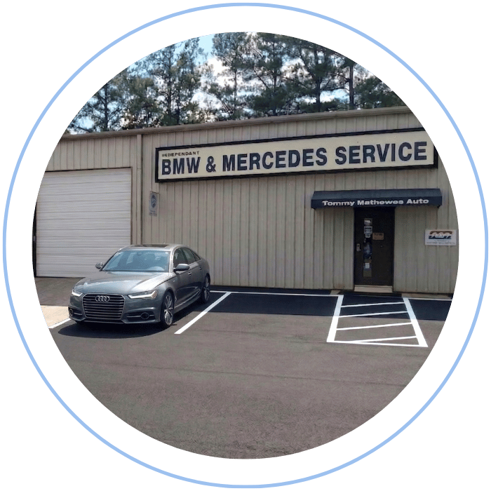 Audi sedan parked in front of Tommy Mathewes Auto Repair