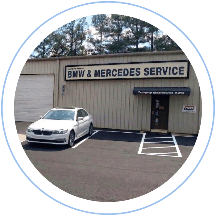 BMW sedan parked outside Tommy Mathewes Auto Repair