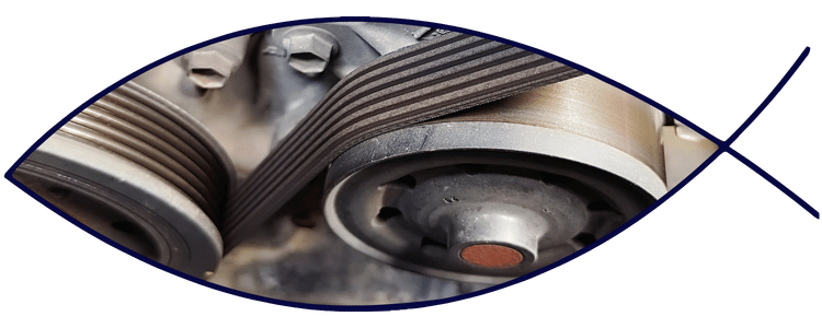 Serpentine belt and pulley system in engine bay