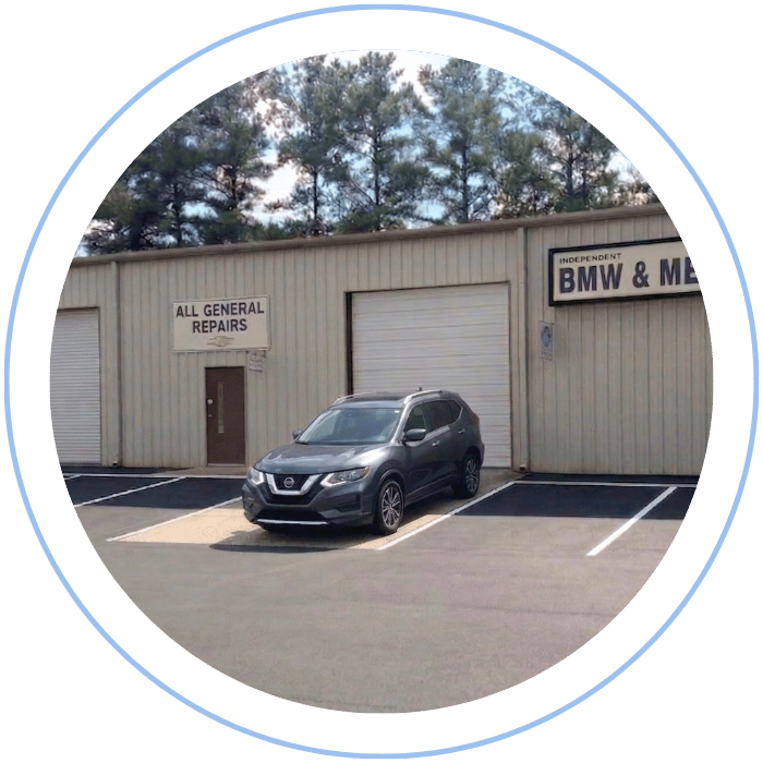 Nissan SUV parked in front of Tommy Mathewes Auto Repair