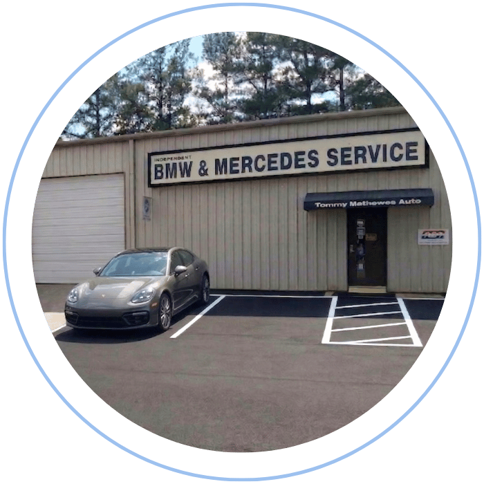 Porsche sedan parked outside Tommy Mathewes Auto Repair