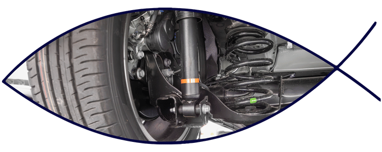 Suspension and steering components near wheel assembly