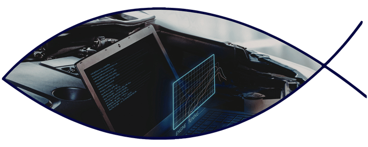 Vehicle diagnostic laptop displaying engine analysis data connected to a vehicle for advanced troubleshooting and testing.