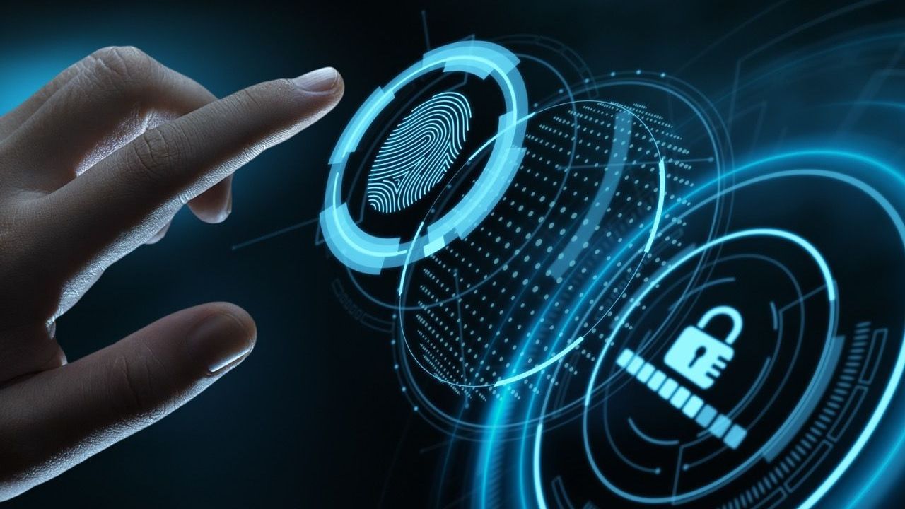 Hand interacting with a digital biometric fingerprint scanner, glowing blue with a loading lock.
