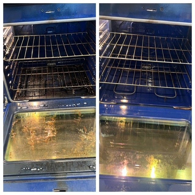 Dirty blue oven with burnt residue on the racks and glass door