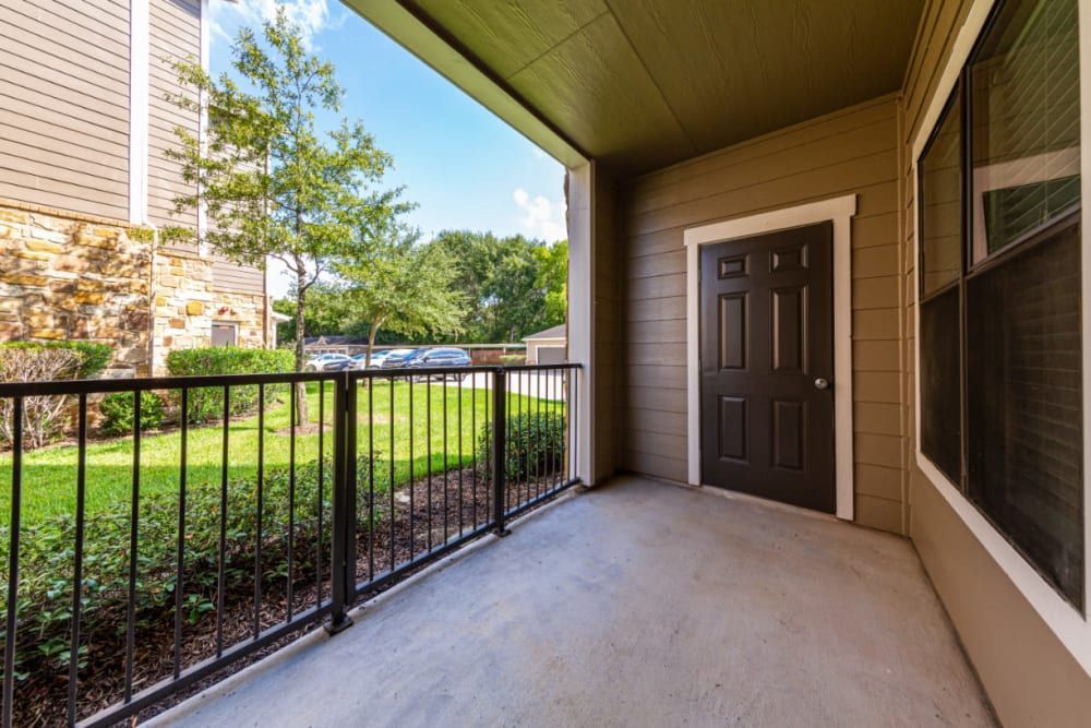 a balcony with a railing and a storage closet at Marquis at Katy in Katy, TX.