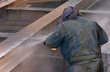 Man Working on the Metal Structure — Linn Grove, IA — Hare Painting & Sandblasting