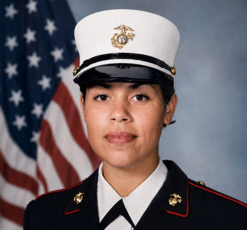 Formal portrait of a uniformed U.S. Marine with an American flag backdrop