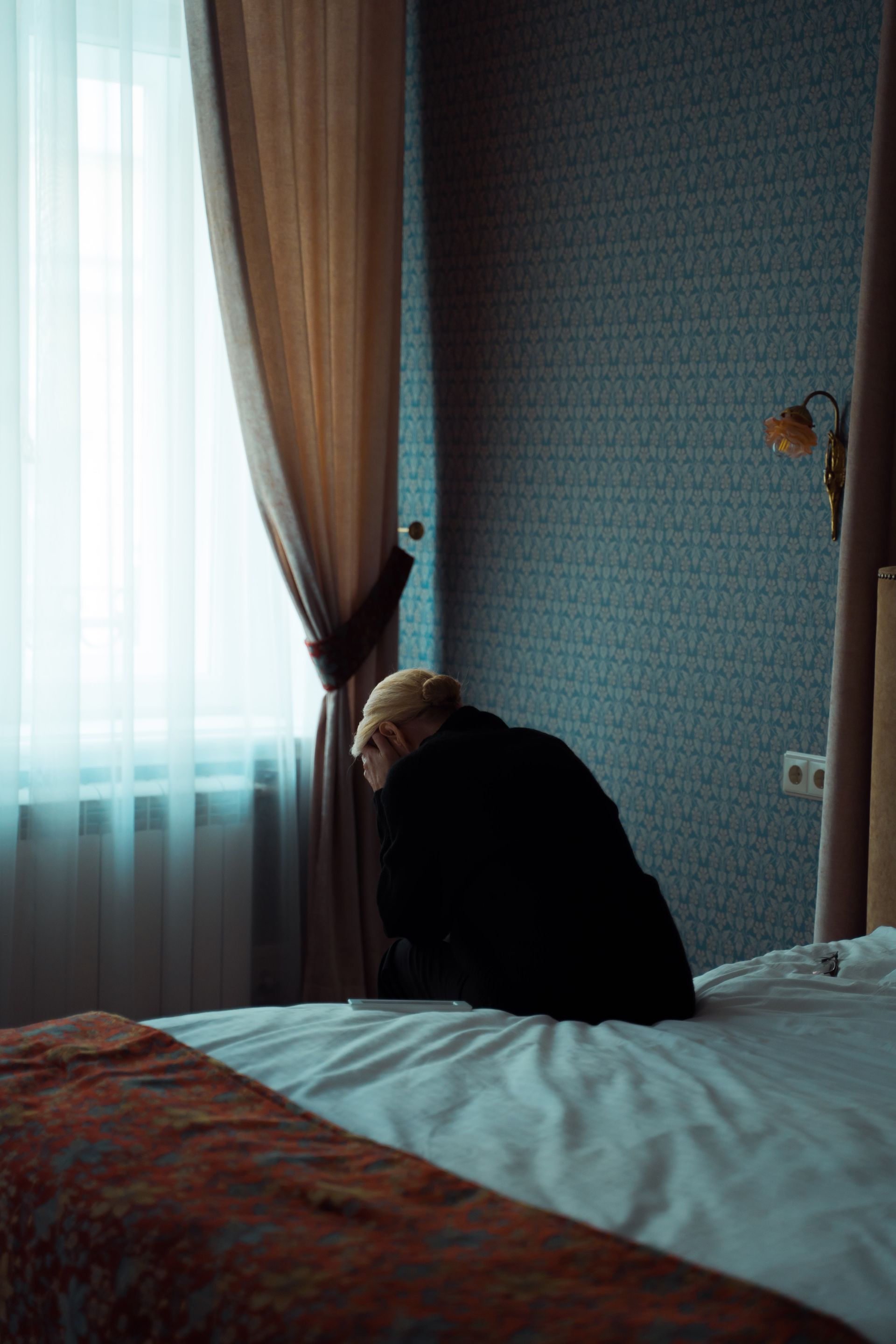 A woman feeling depressed in her bedroom - Adult Therapy on Wurtulla, QLD