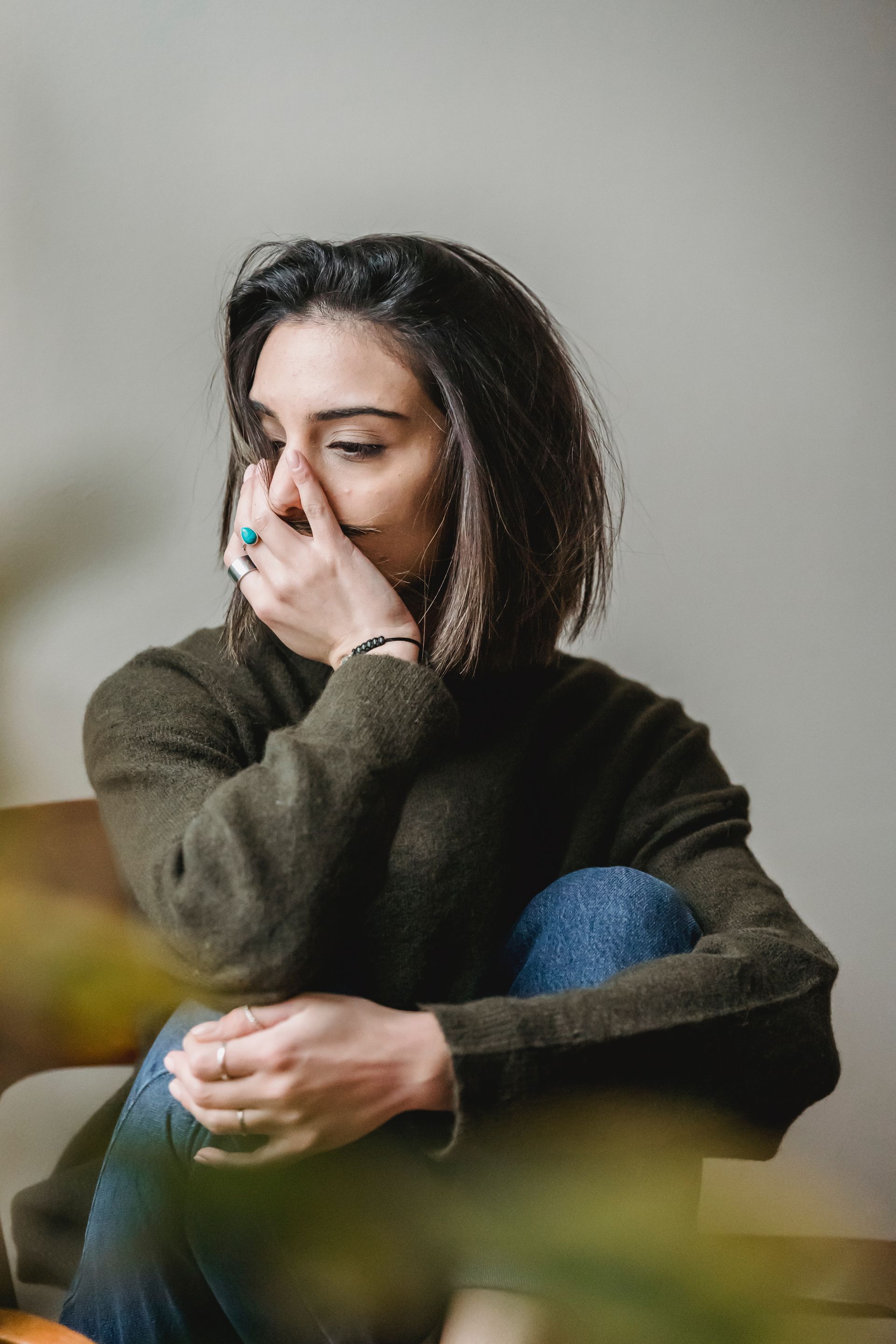 Sad tired young woman touching forehead having headache - Adult Therapy on Wurtulla, QLD