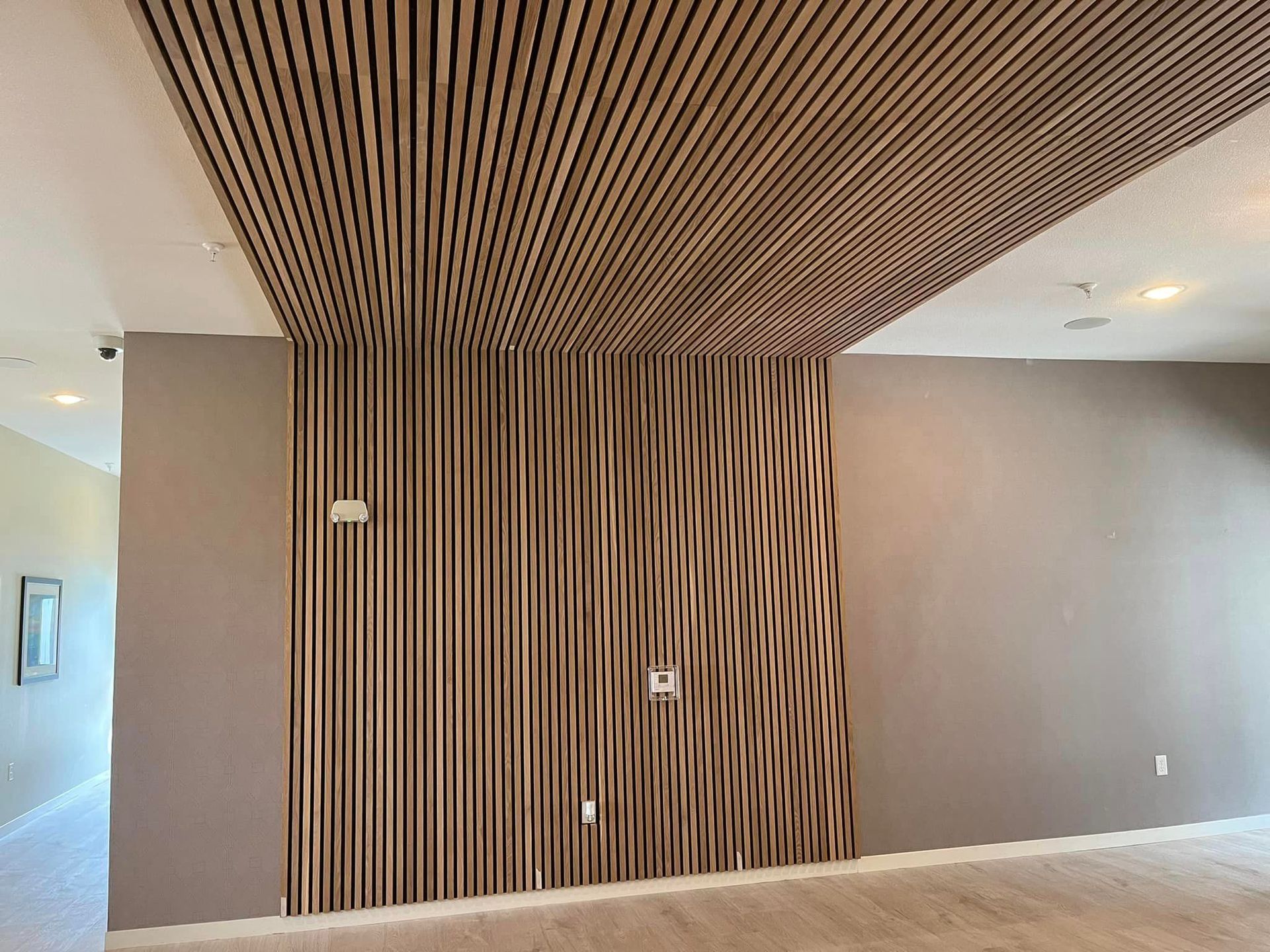 A room with a wooden ceiling and a wooden wall.