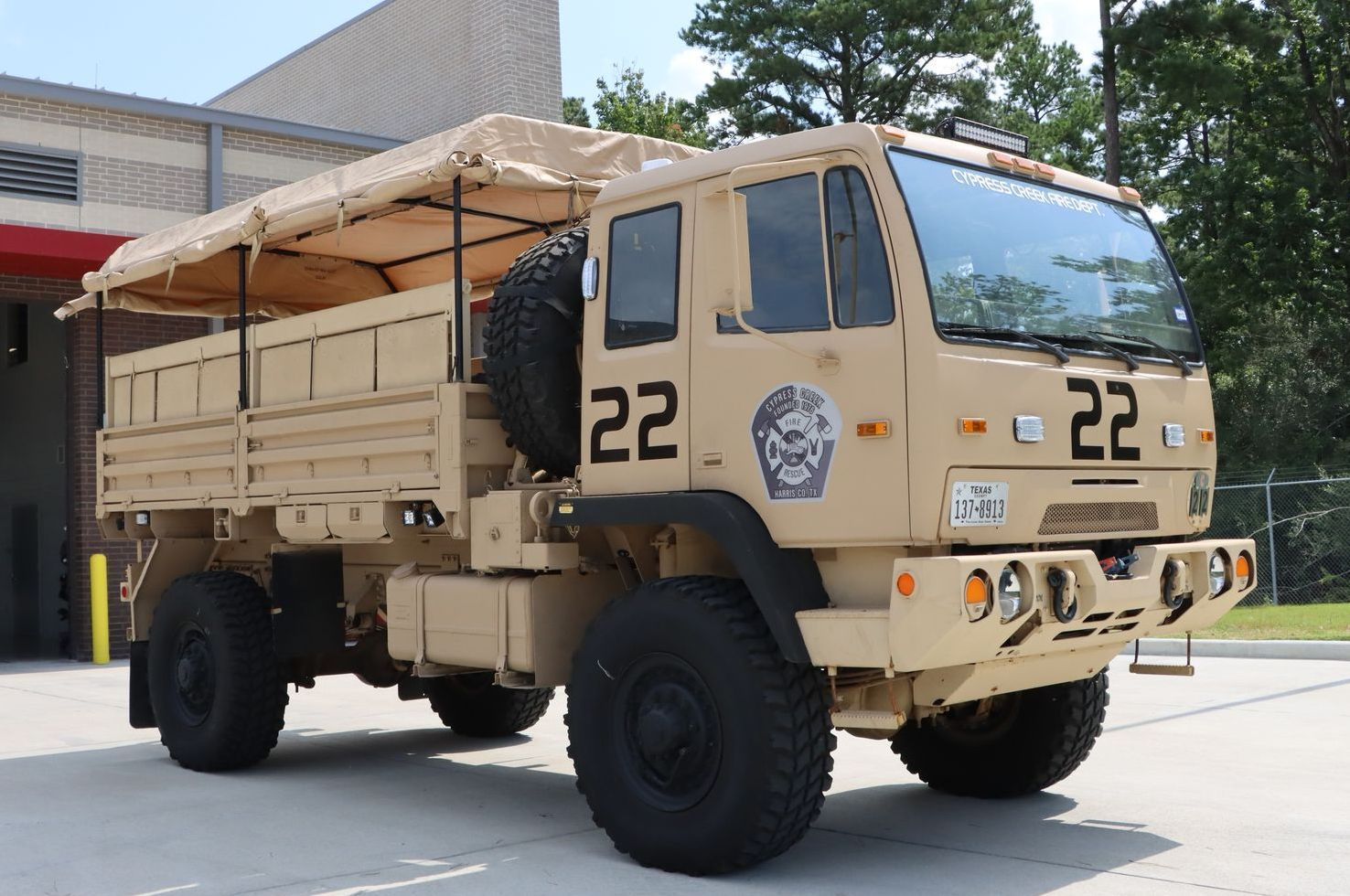 A military truck with the number 22 on the side. Cypress Creek Heavy Utility Truck 22.