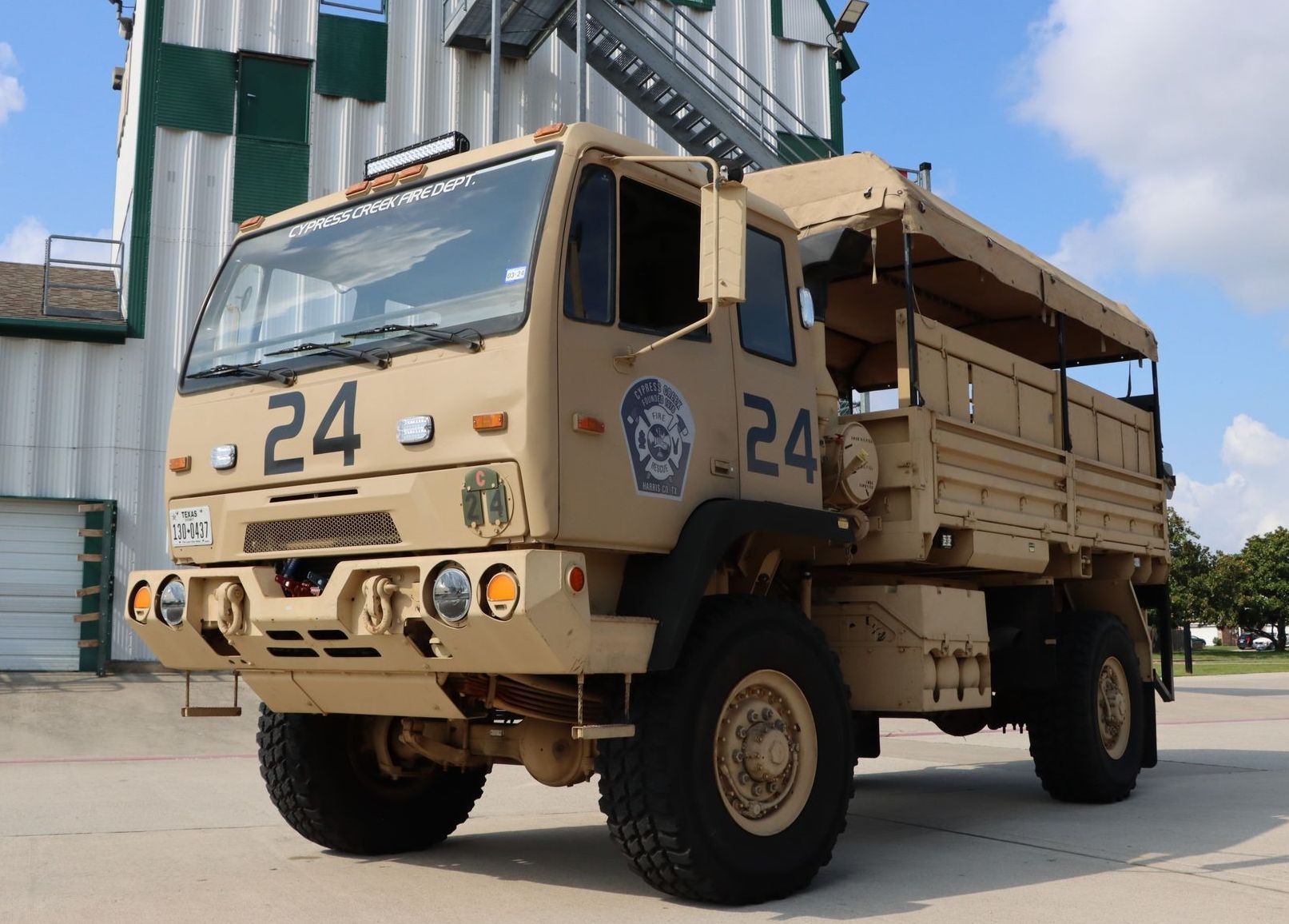 A military truck with the number 24 on it. Cypress Creek Heavy Utility Truck 24.
