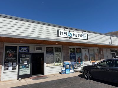 The Pier 13 Liquor storefront in Avon