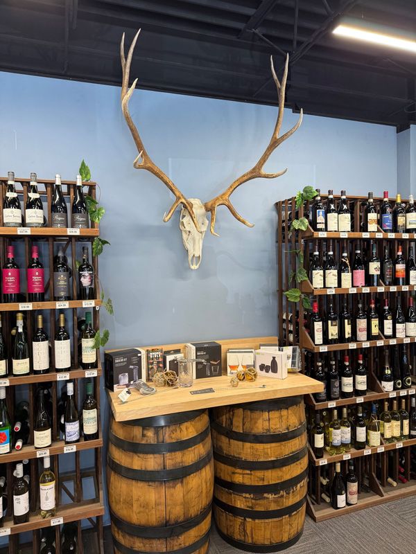 Barrel table with cocktail tools and glassware