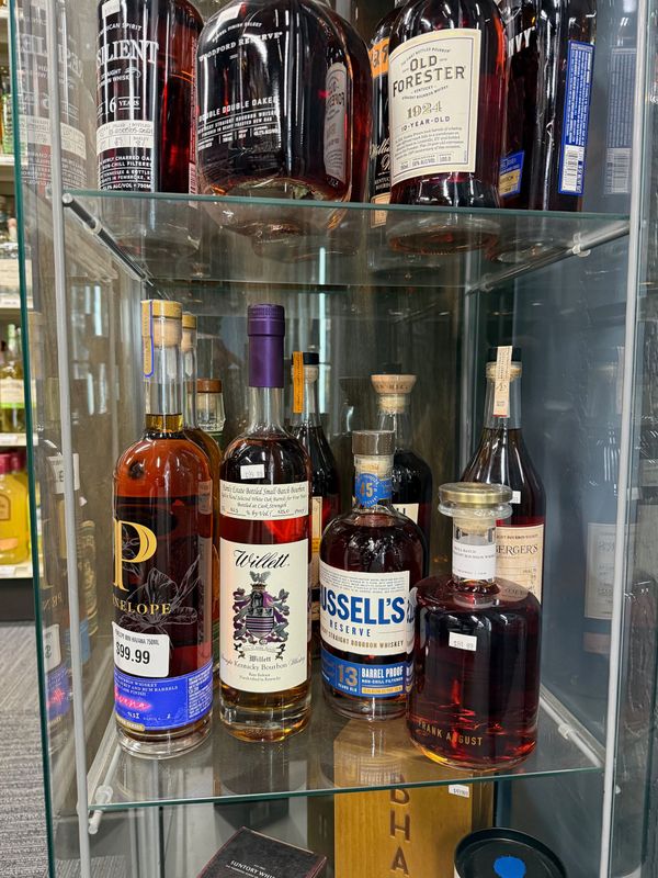Locked case of rare and allocated bourbon bottles