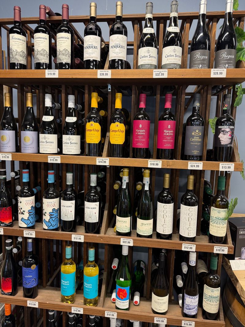 Wooden rack of Spanish red and white wines including Rioja and Ribera del Duero