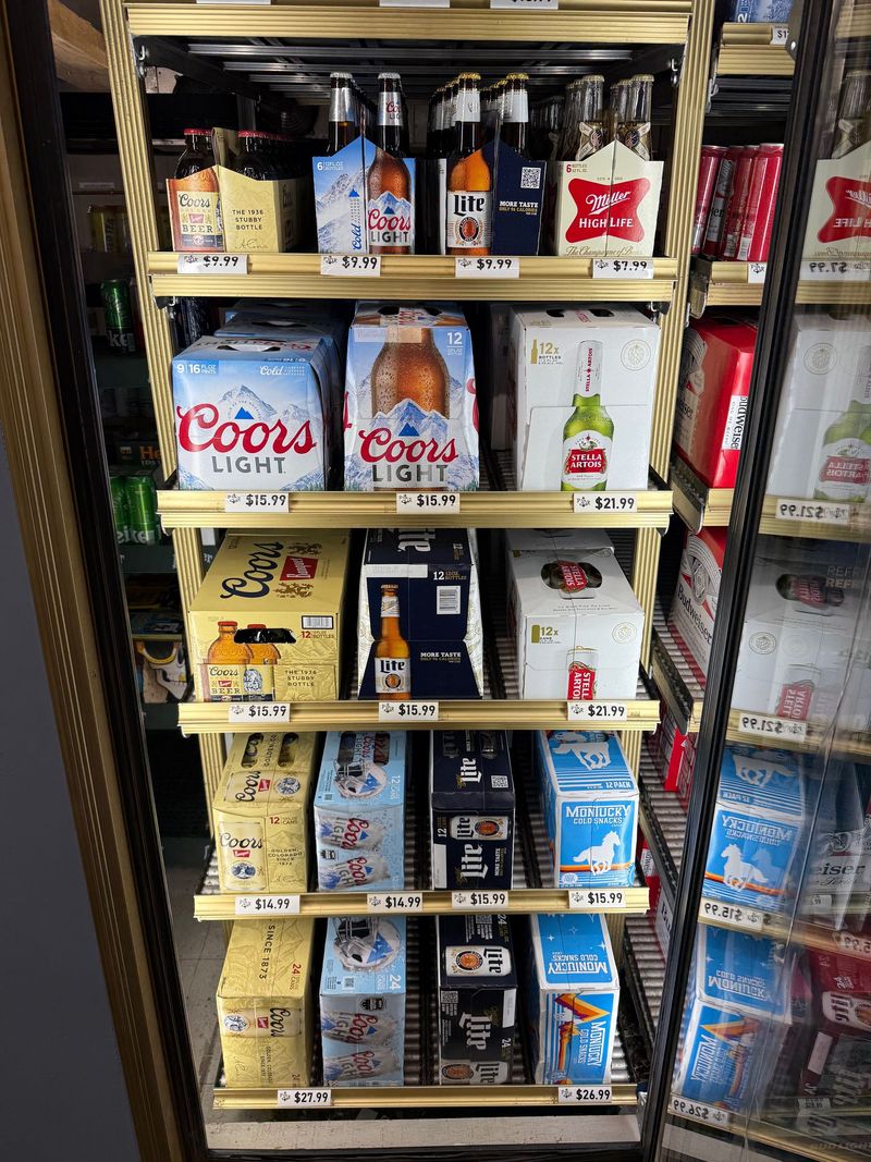 Cold case of Coors, Miller and Stella Artois six-packs and cases