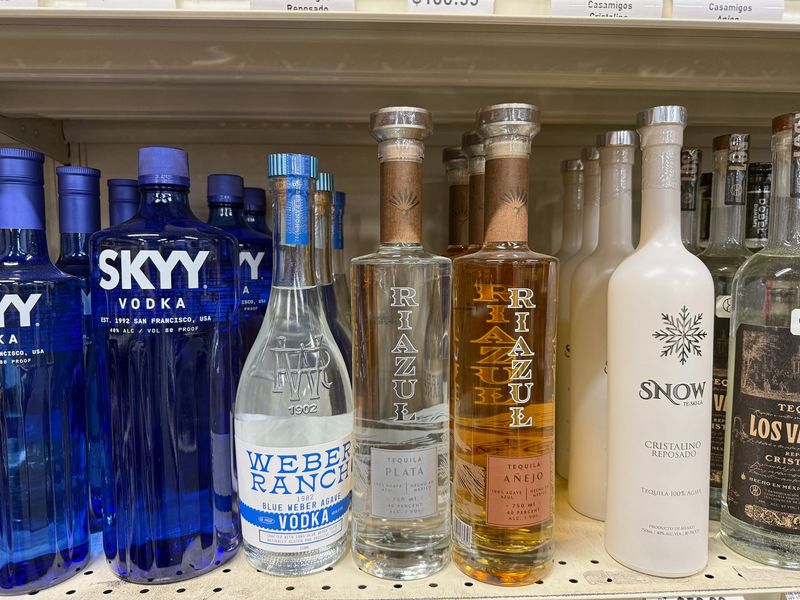Vodka and tequila bottles including Skyy, Weber Ranch and Riazul