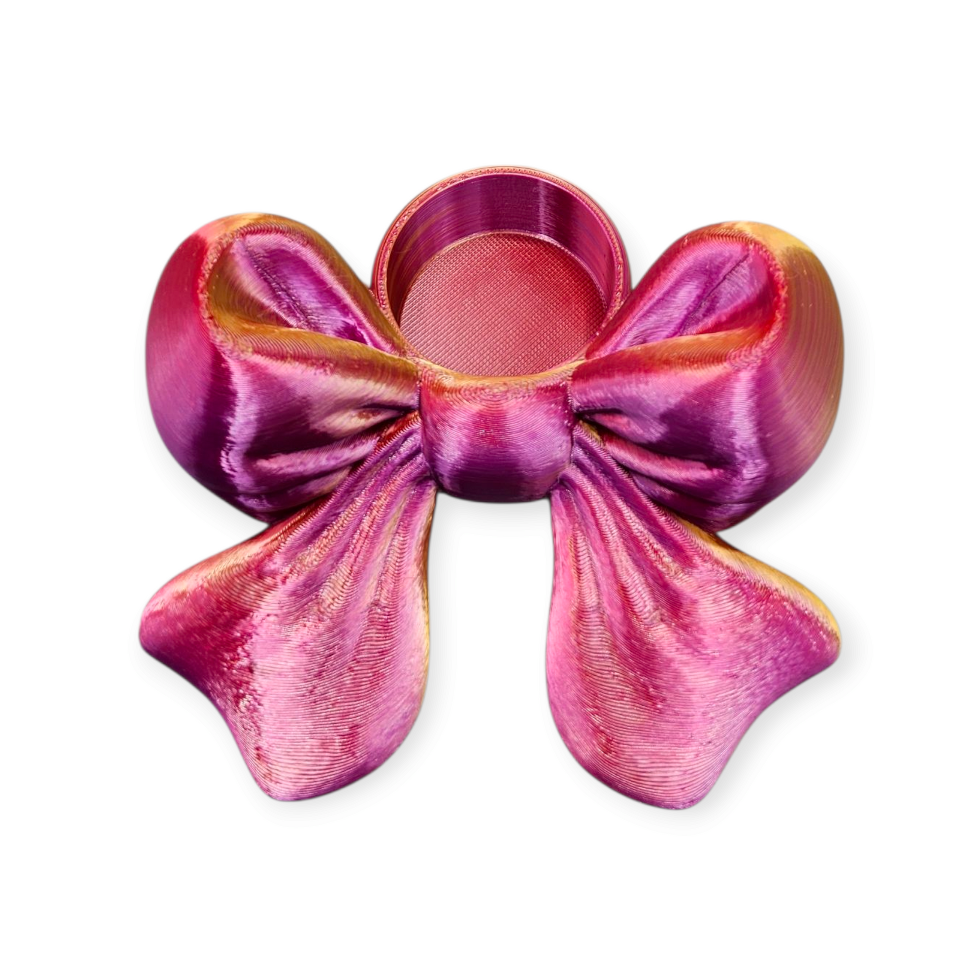 Een glanzende, magenta, 3D-geprinte decoratieve strik met een kleine ronde inkeping in het midden bovenaan.