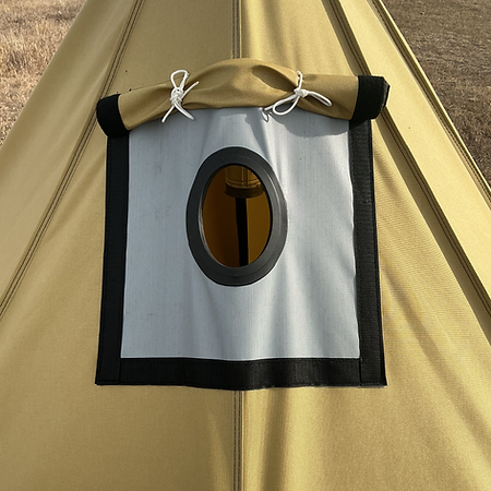 A beige tent features a square, gray heat-resistant panel with a central oval window for a stove pipe on its exterior.