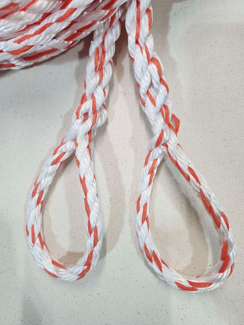 A coiled white rope with orange flecks, featuring two braided loops extending from the main spool.
