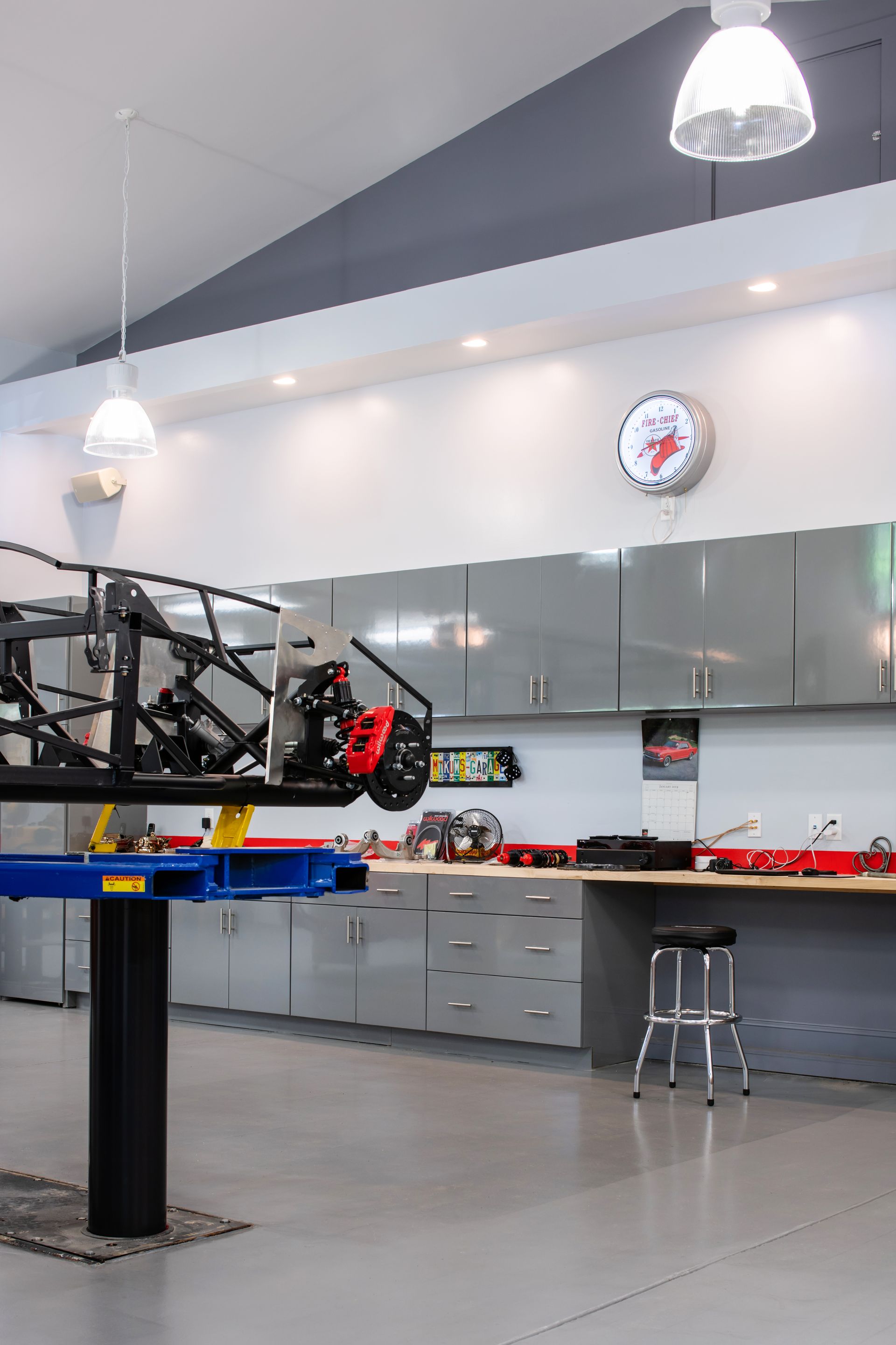 a garage with a clock that says ' ford ' on it