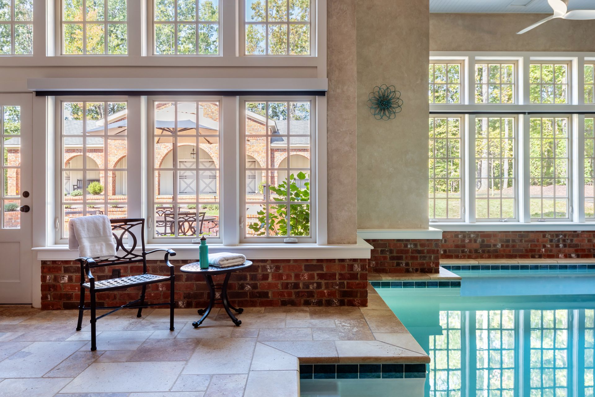 indoor pool with large windows