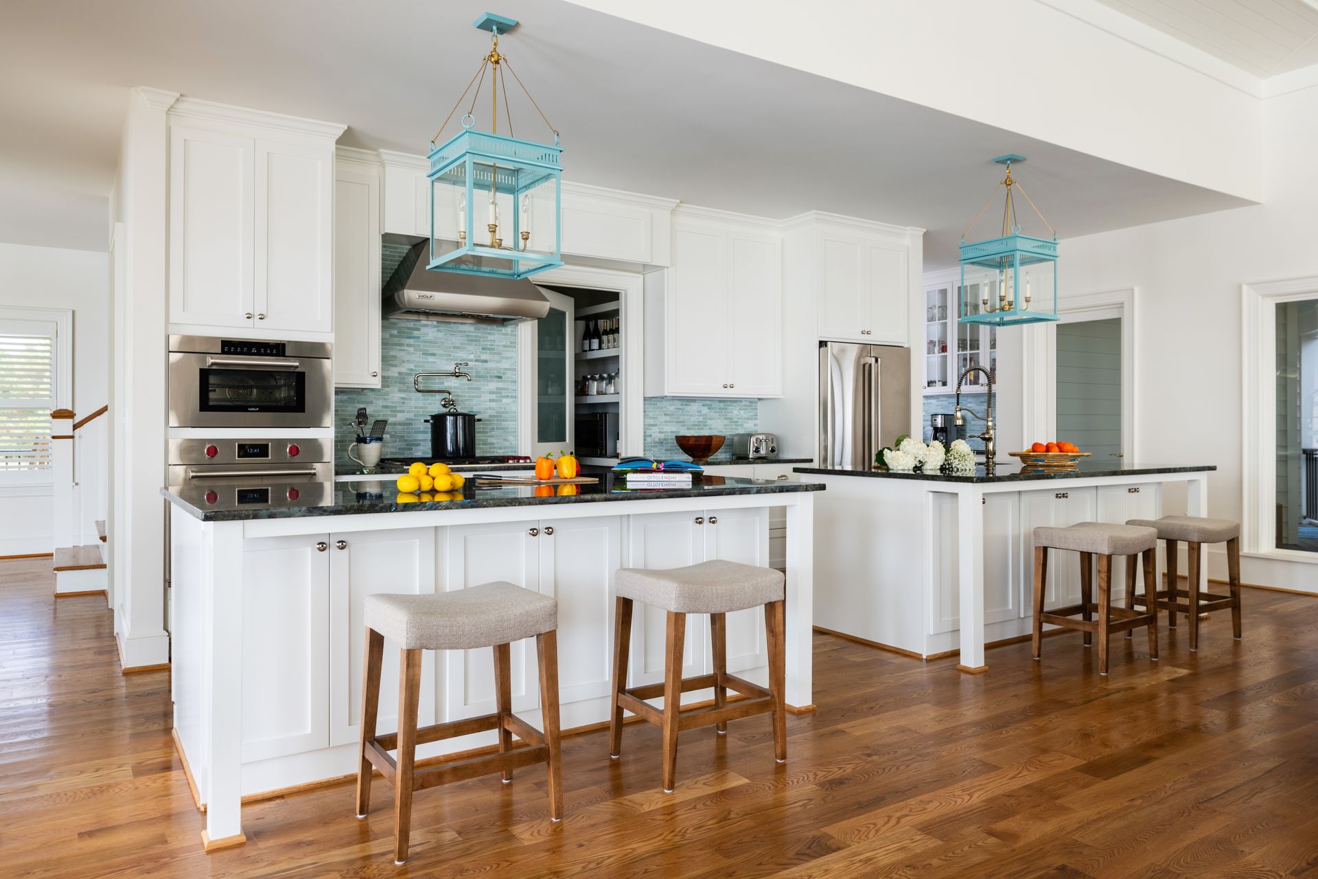 a kitchen with blue lanterns hanging from the ceiling