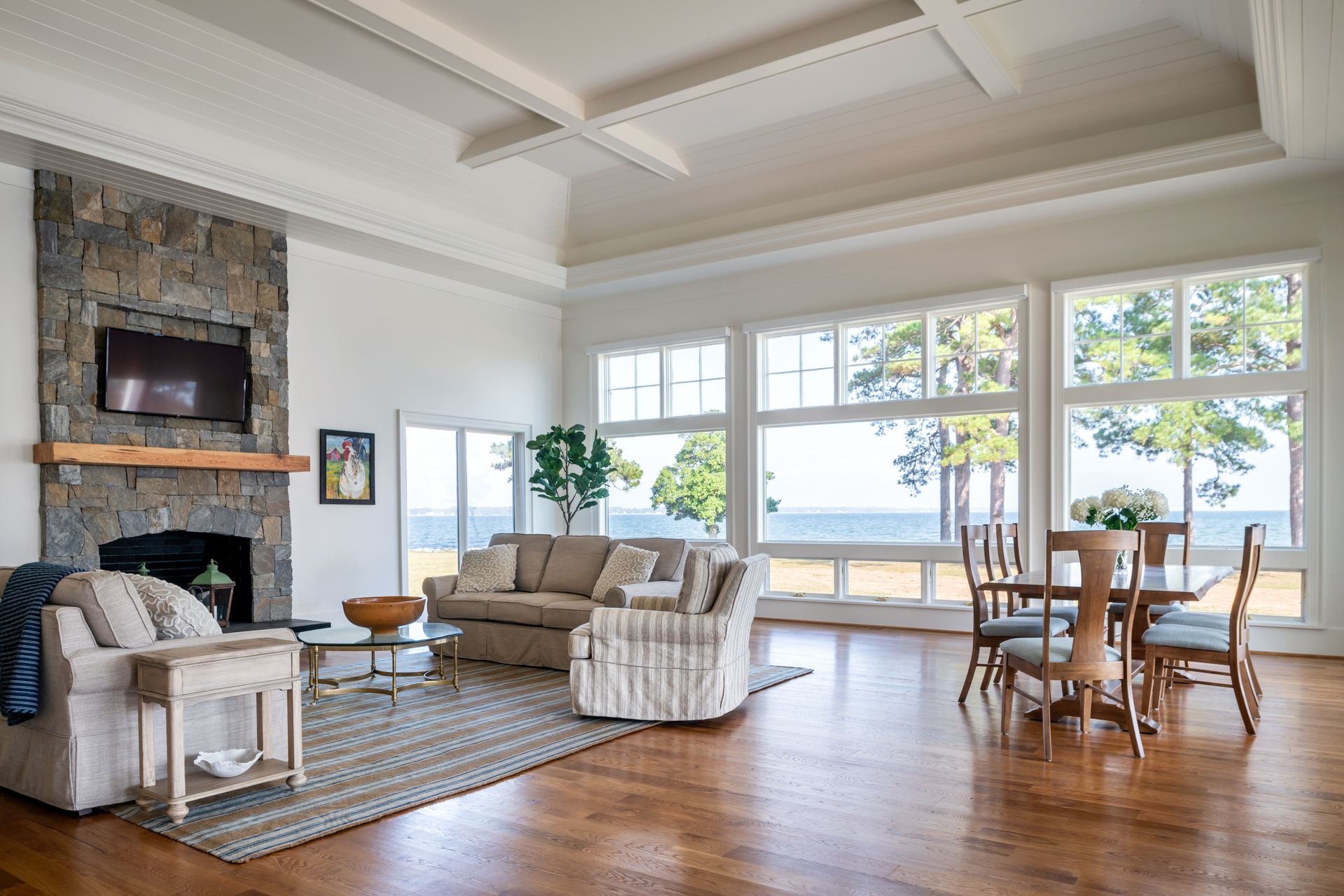a living room with a couch and chairs and a fireplace