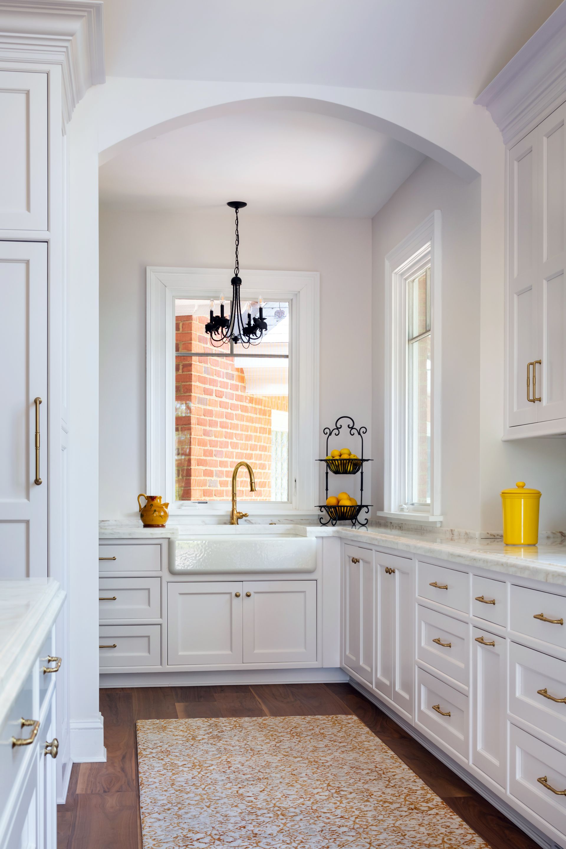 image of a butlers closet with white cabinets and countertops