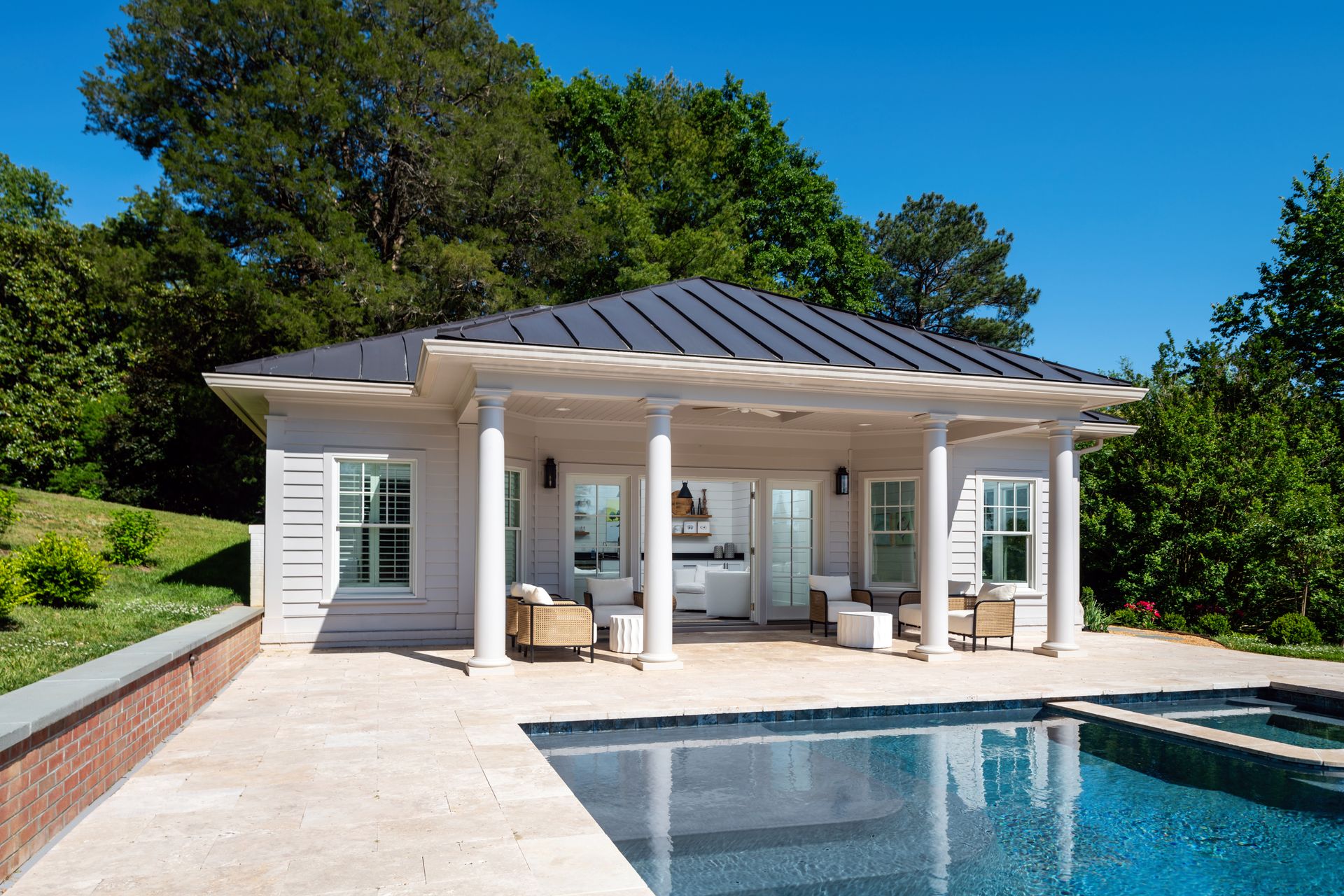 pool house overlooking a large pool