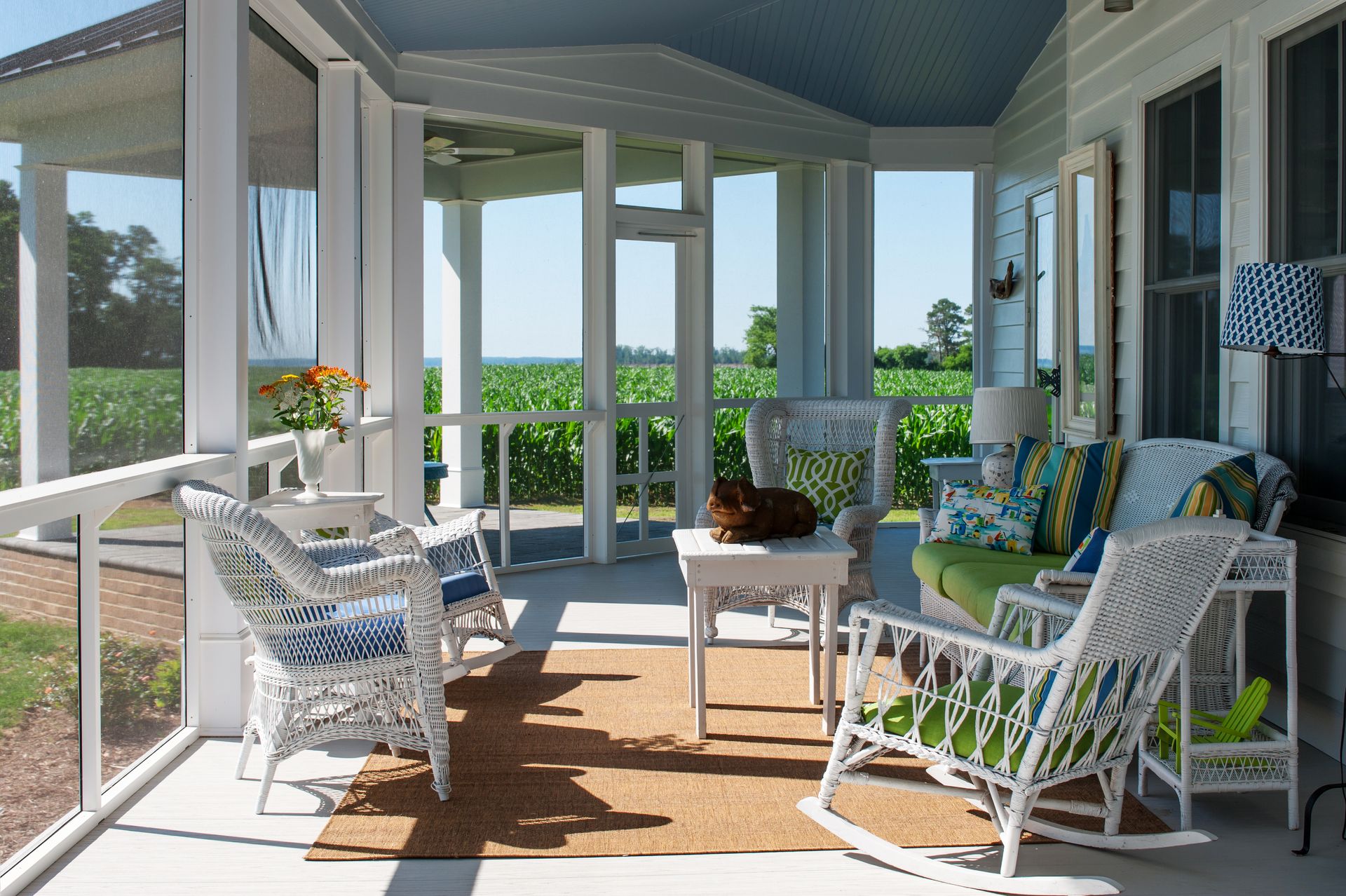 screened in porch with rocking chairs