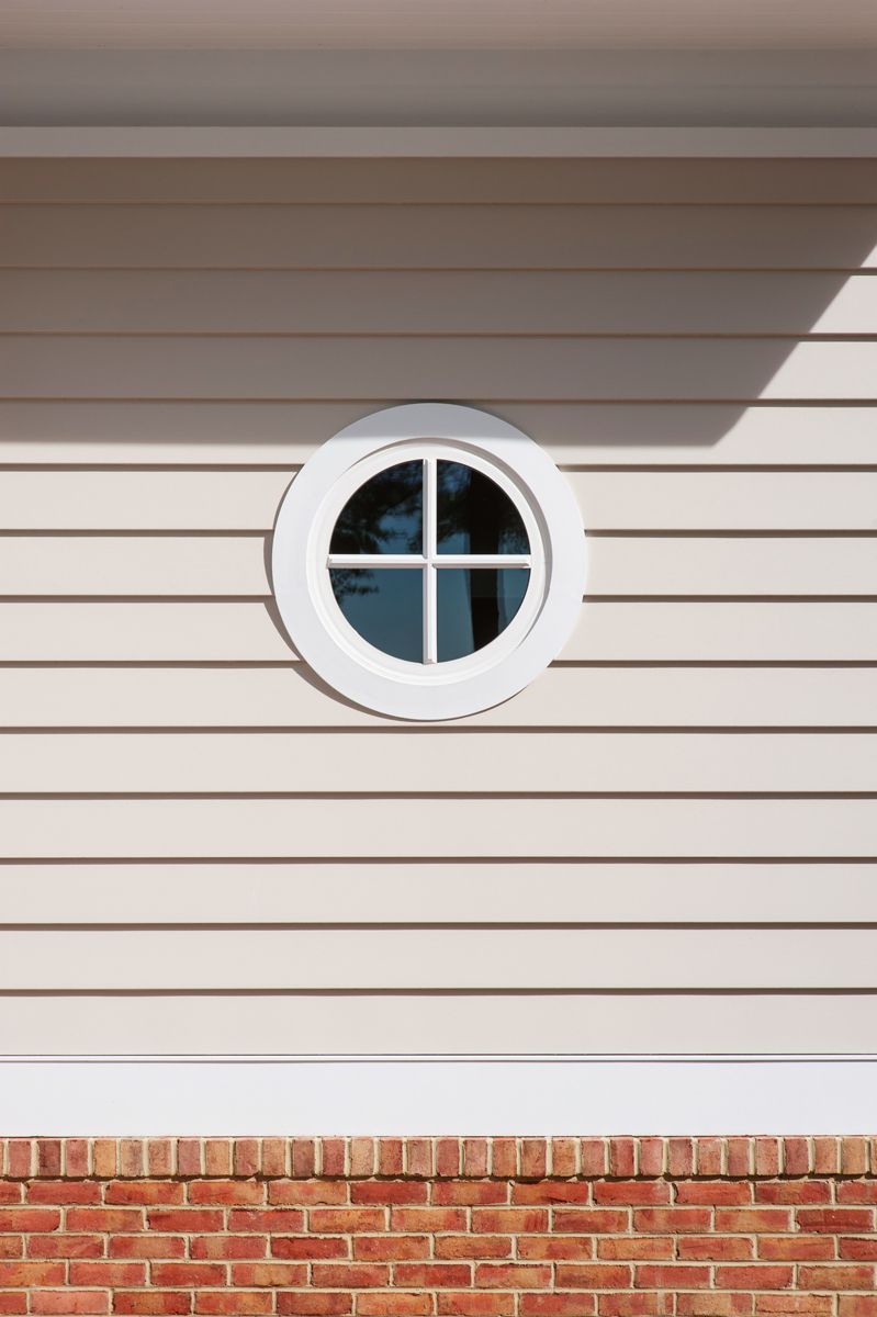 a close up of a white siding on a building