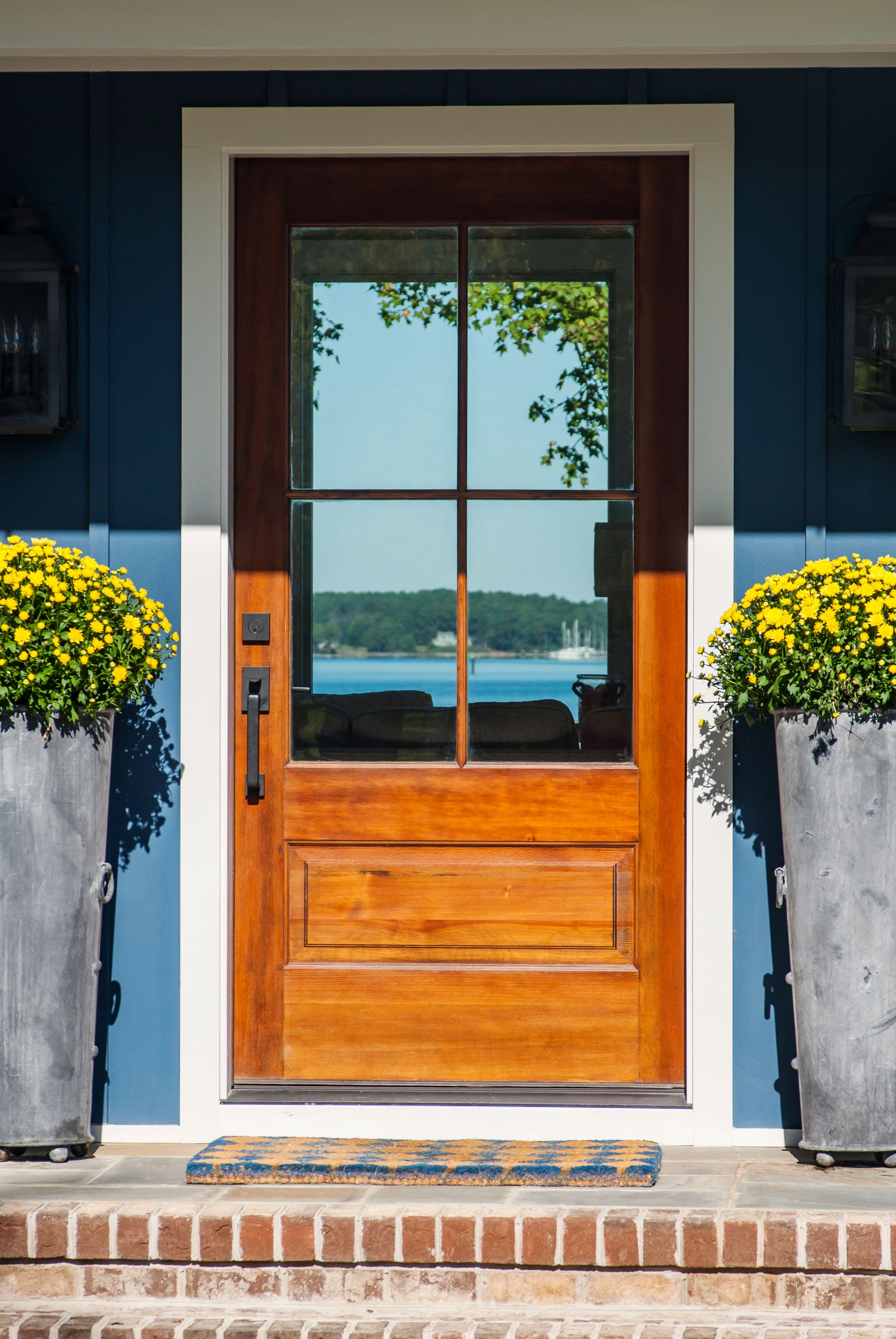 the front door of a house with a view of the water