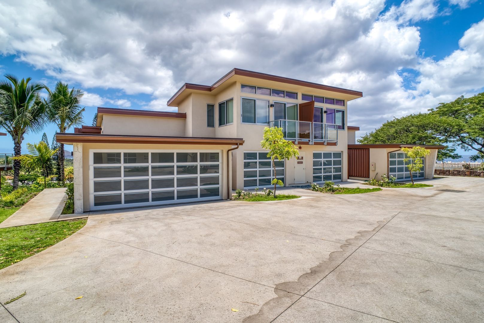 Curb appeal with trimmed tropical landscaping