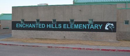 A sign for the enchanted hills elementary school