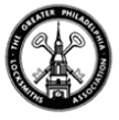 A black and white circular logo for The Greater Philadelphia Locksmiths Association, featuring a steeple and two keys.