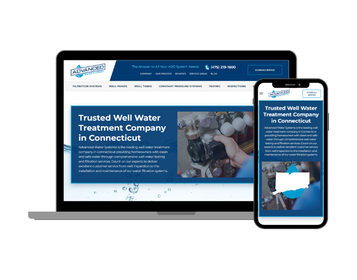 A laptop and a cell phone are sitting next to each other on a white background.