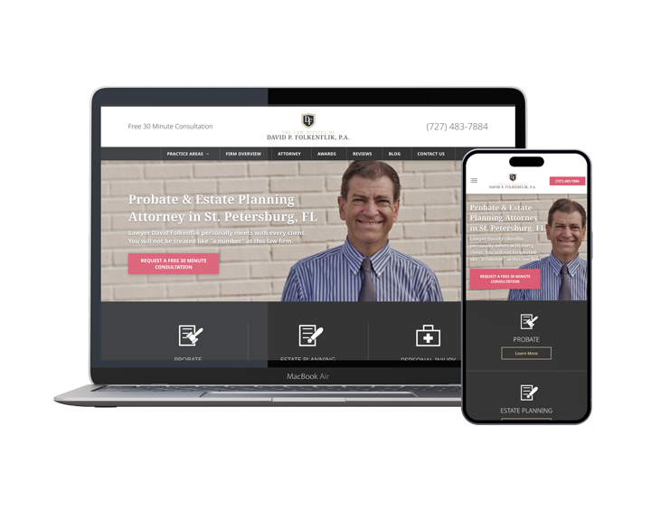 A laptop and a cell phone are sitting next to each other on a white background.