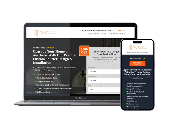 A laptop and a cell phone are sitting next to each other on a white background.