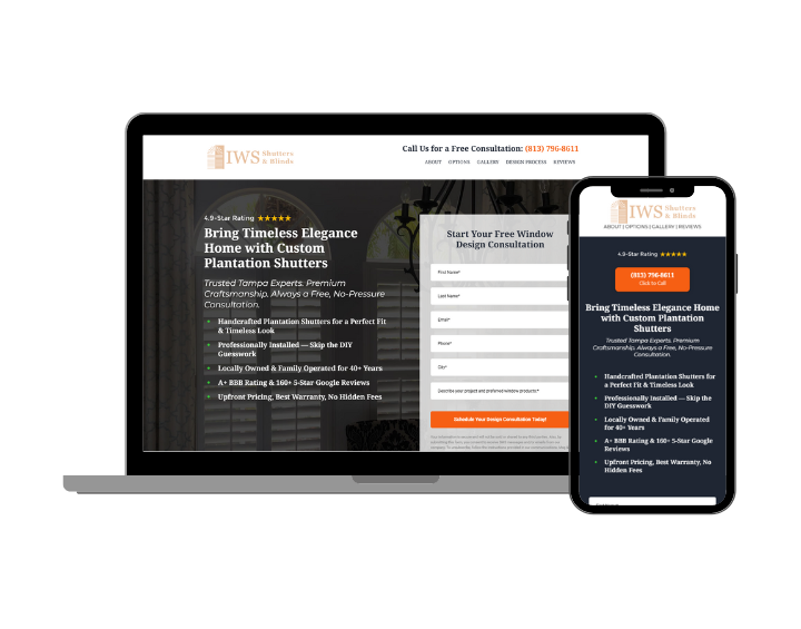 A laptop and a cell phone are sitting next to each other on a white background.