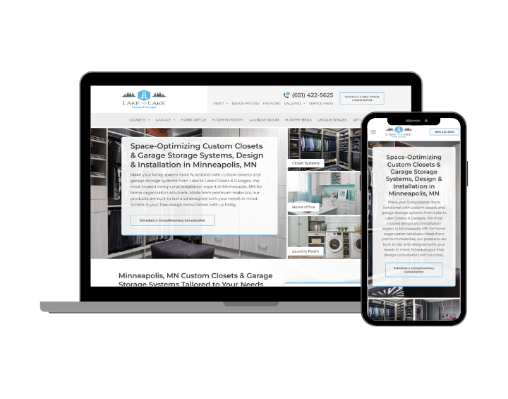 A laptop and a cell phone are sitting next to each other on a white background.