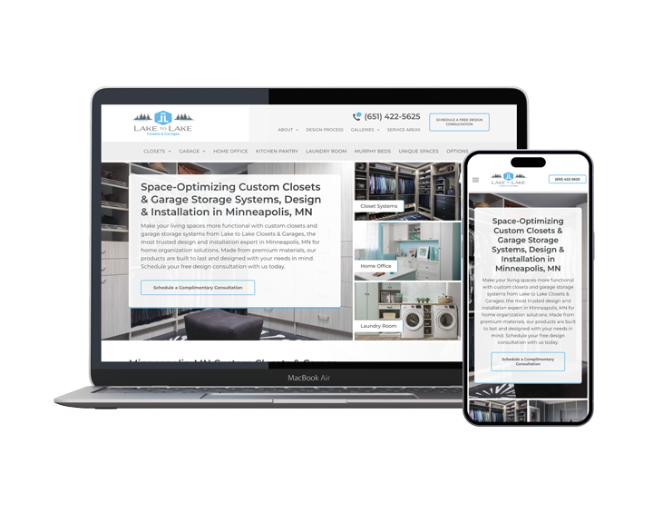 A laptop and a cell phone are sitting next to each other on a white background.